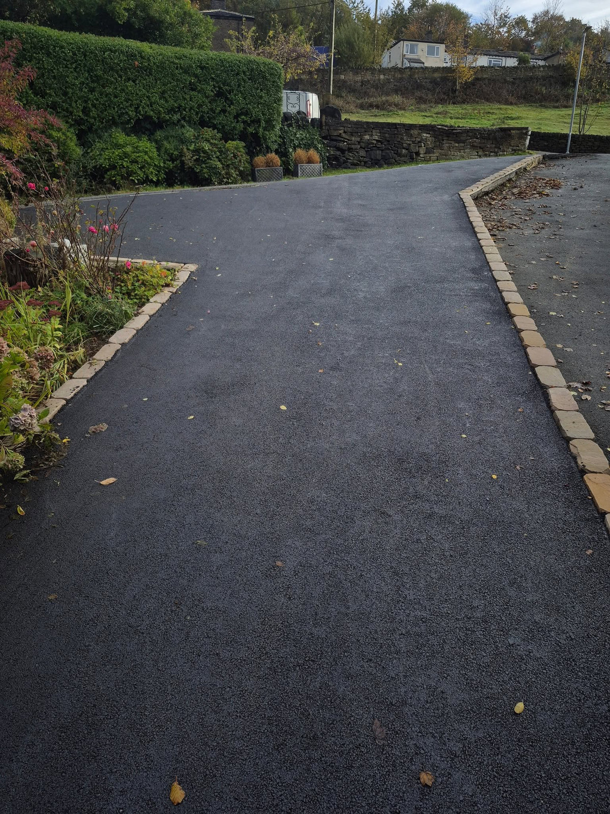 Tarmac driveway with stone edging