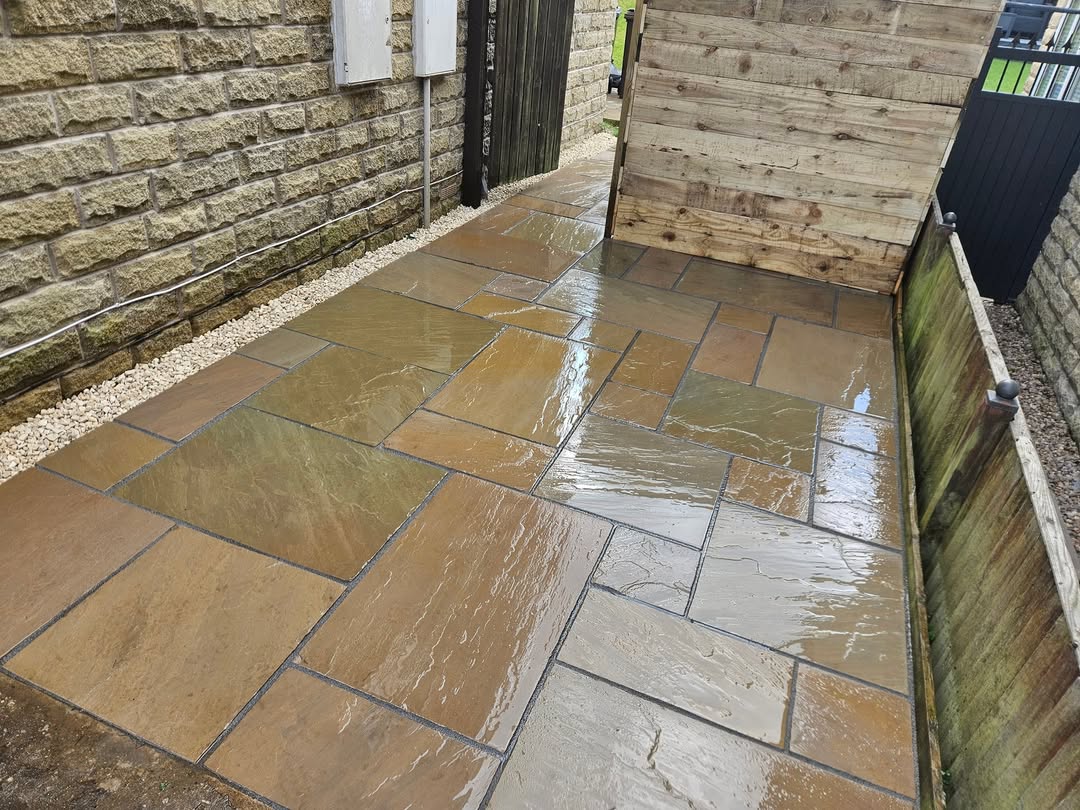 Indian sandstone paving beside a stone house