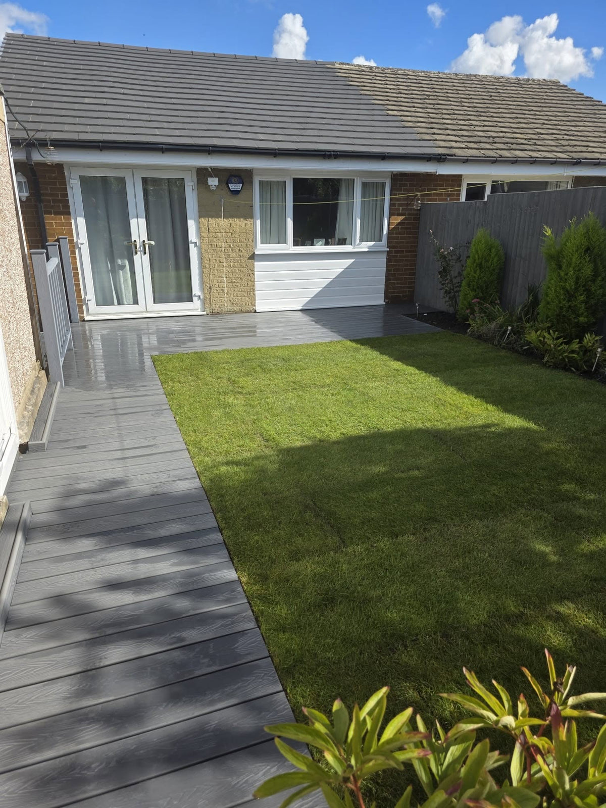 Turfed garden beside composite decking