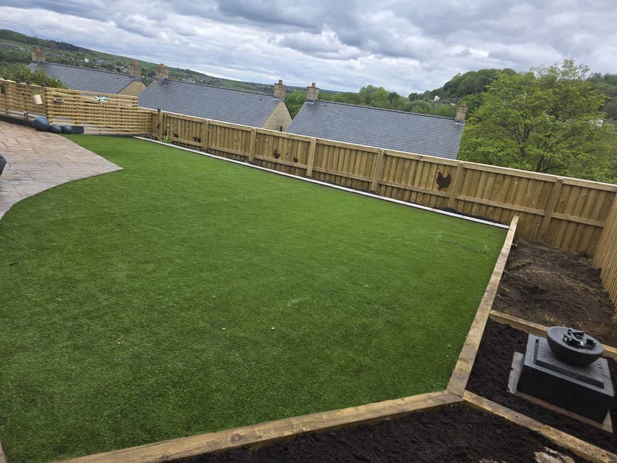 Artificial grass lawn with timber edging