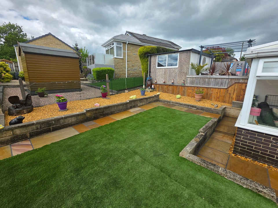 Artificial grass garden beside a raised seating area